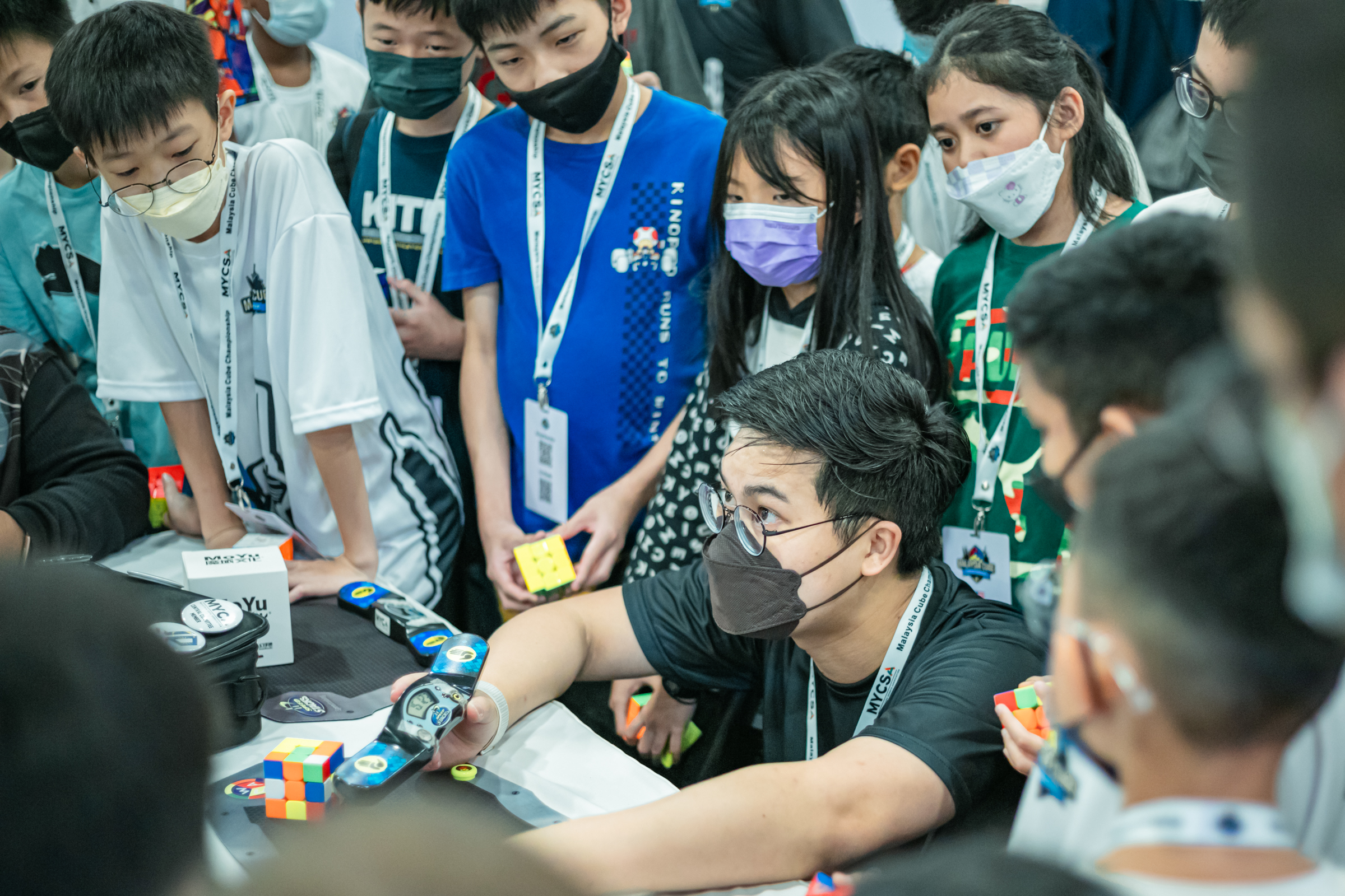Yi Jun with students at international competitions 🇲🇾