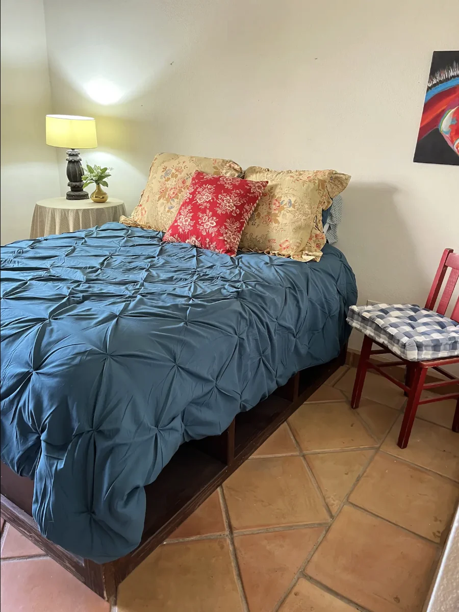 Bedroom at Casa Alba with a made-up queen bed