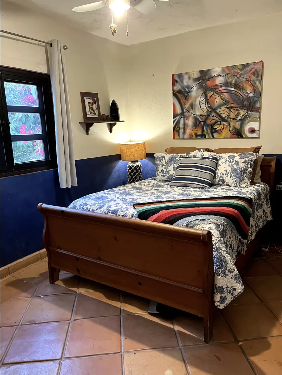 Bedroom at Casa Alba with a carved wooden bed