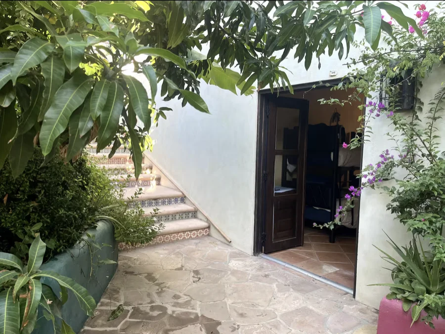 Stairway and doorway through Casa Alba's garden