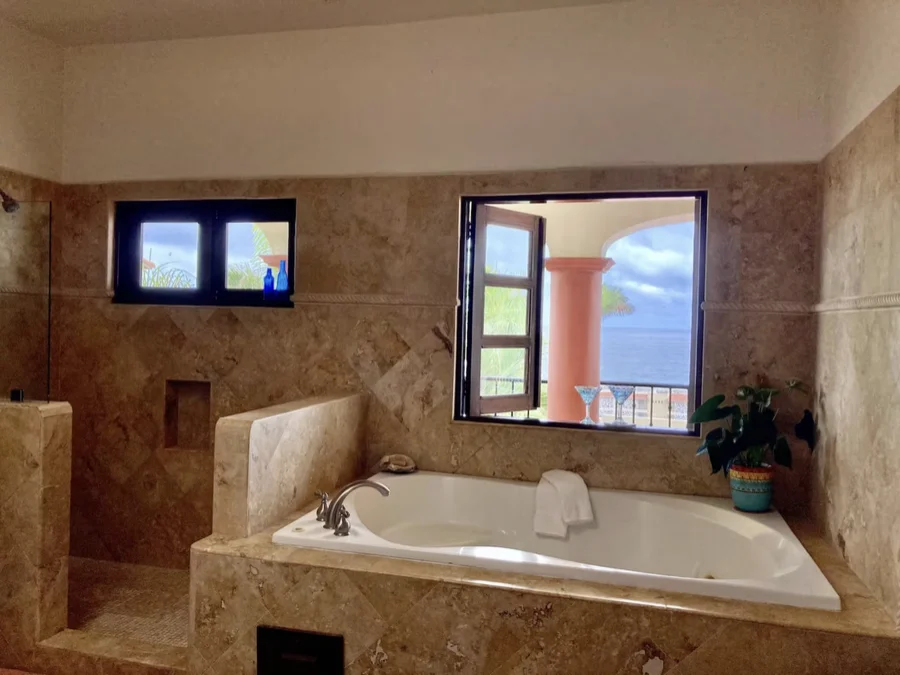 Bathroom at Casa Alba with a soaking tub beside a window