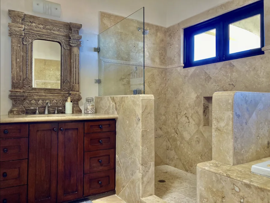 Bathroom at Casa Alba with a walk-in shower and stone vanity