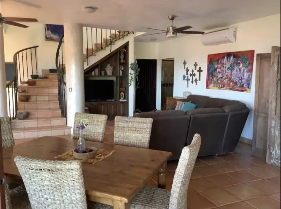 Main living room at Casa Alba with staircase and seating