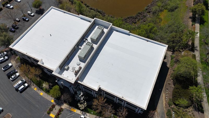 Aerial view of a commercial roof monitored by Roof IQ