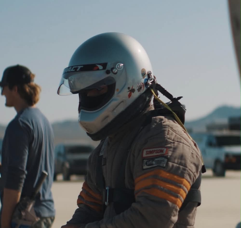 Kaden suited up in helmet and fire suit at Bonneville