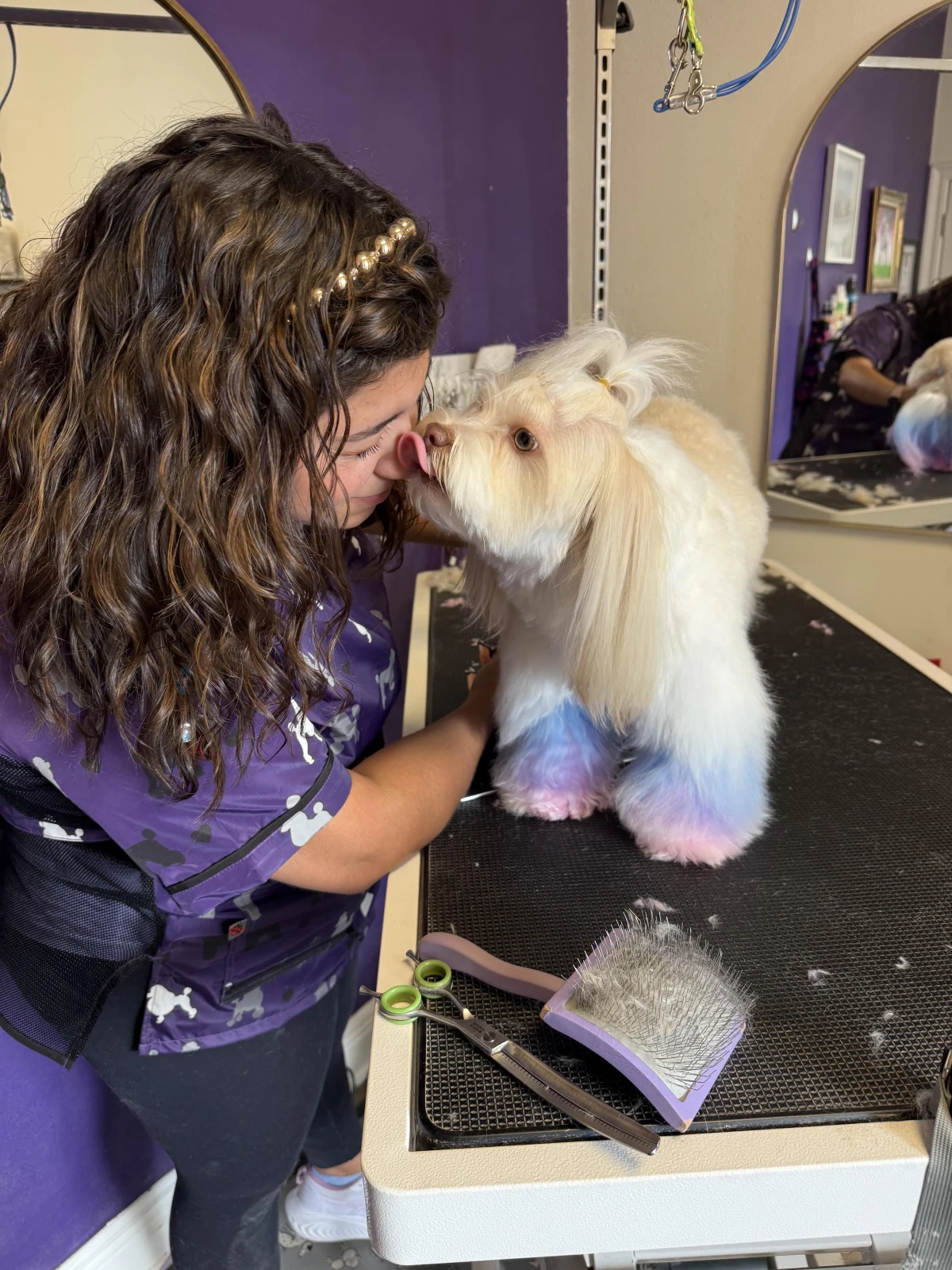Reneé grooming a happy pup