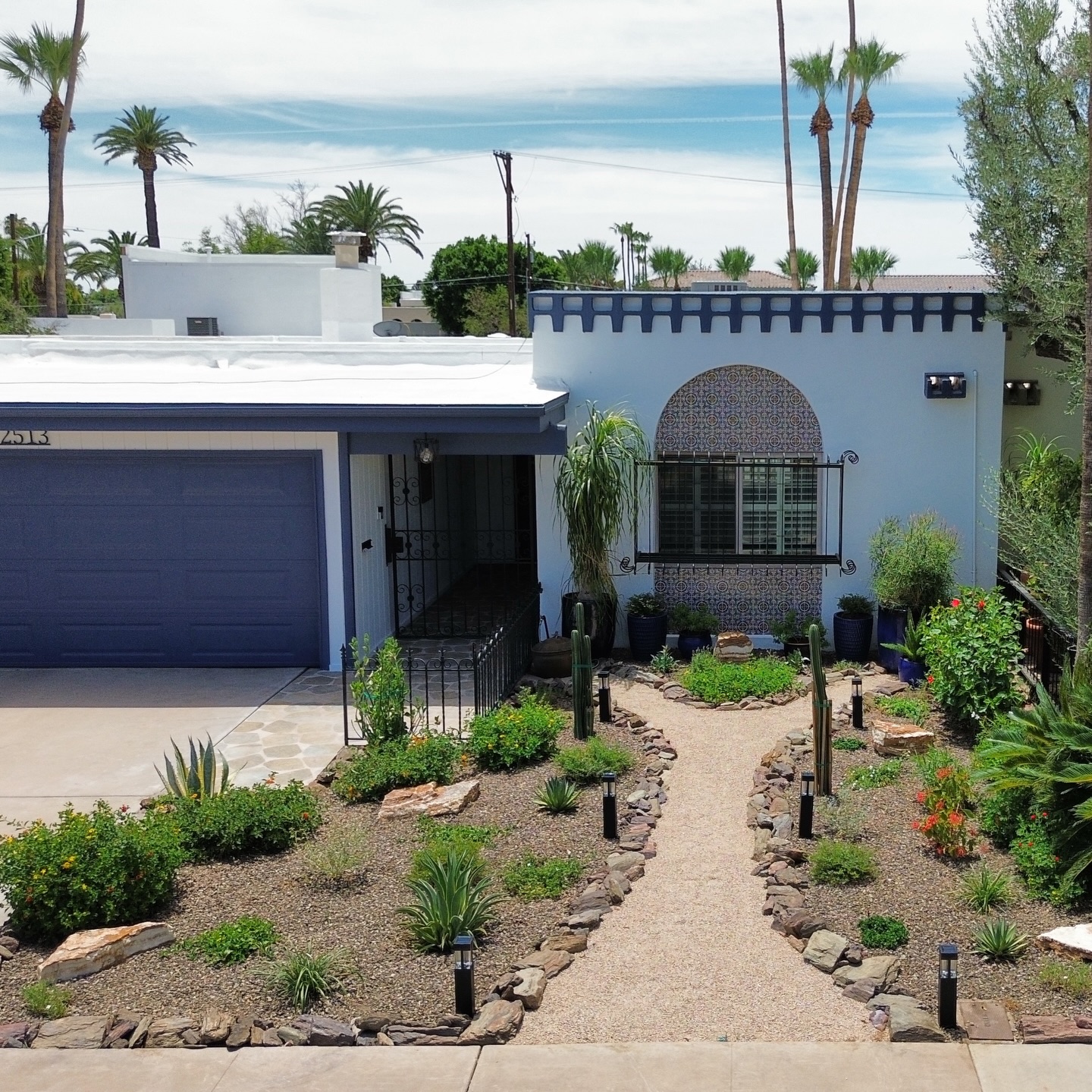 Spanish-style home with arched tile entry, an AZ Elevate project in Phoenix AZ
