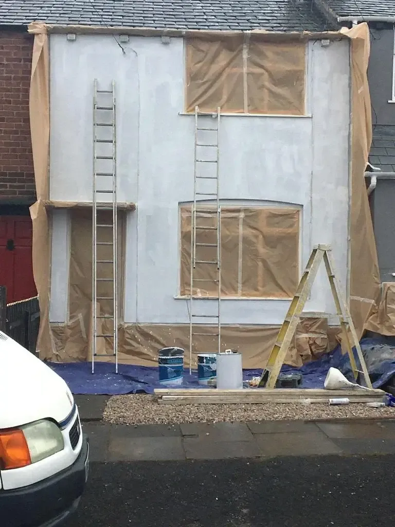 Pinnacle Wall Coatings team applying exterior wall coatings in Kettering