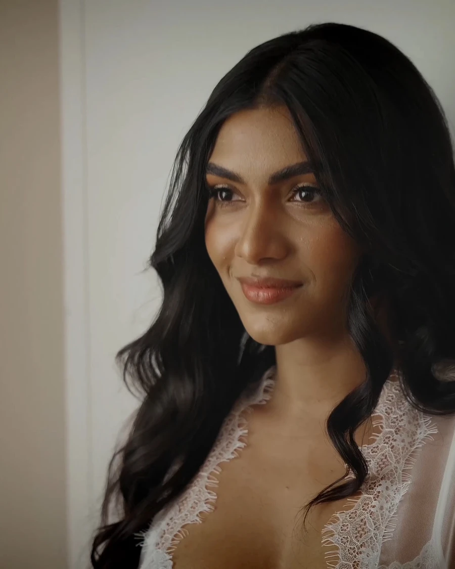 A bride smiling, a still from one of our wedding films