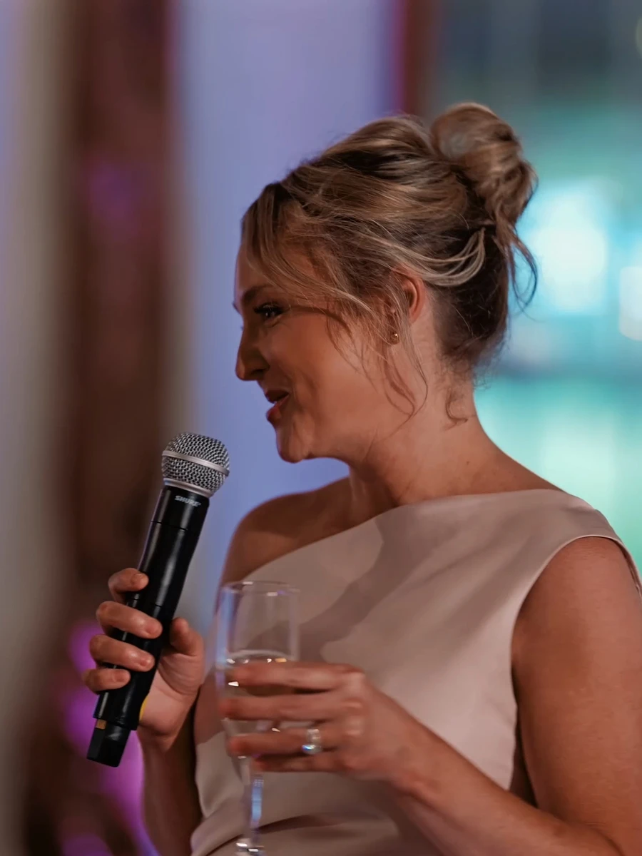 The maid of honor laughing through her toast